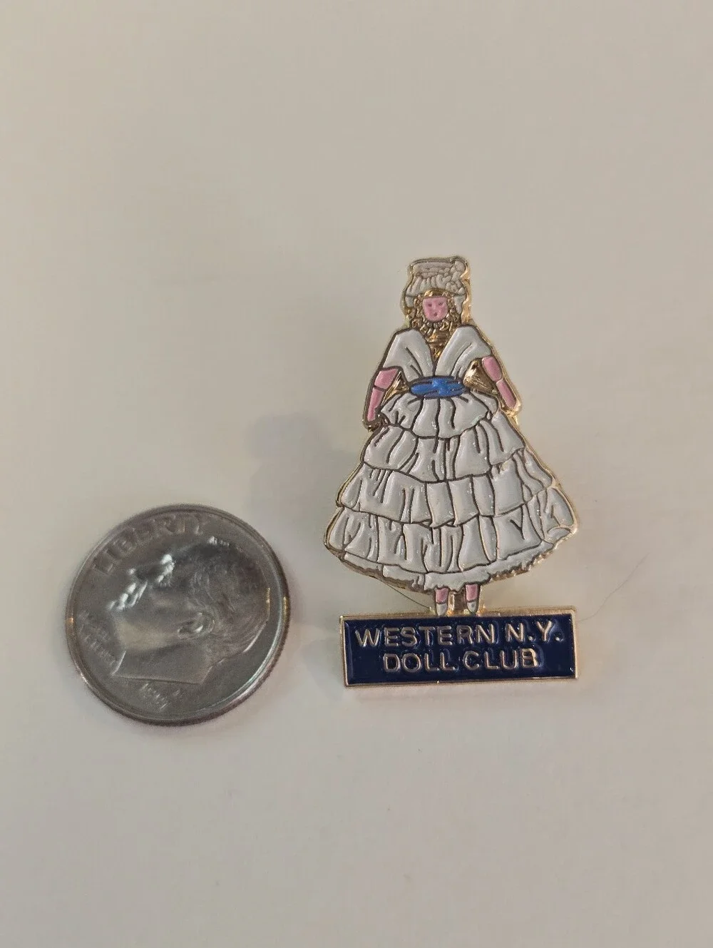 None enamel doll